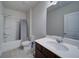 Bright bathroom featuring a shower-tub combination with sleek fixtures and vanity with a large mirror at 3690 Summerpoint Xing, Cumming, GA 30028