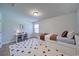 Cozy bedroom with a twin bed, stylish rug, small desk, and natural light, perfect for a or guest at 3690 Summerpoint Xing, Cumming, GA 30028