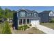 Charming two-story home with a welcoming front porch and well-kept landscaping at 3690 Summerpoint Xing, Cumming, GA 30028
