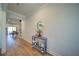 Hallway with hardwood floors and a view into the dining room and entrance at 3690 Summerpoint Xing, Cumming, GA 30028
