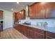 A gourmet kitchen featuring modern appliances and granite countertops at 3690 Summerpoint Xing, Cumming, GA 30028