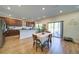 Open concept kitchen leading to a dining area with a sliding door to the backyard at 3690 Summerpoint Xing, Cumming, GA 30028