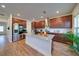 Spacious kitchen featuring a large kitchen island, stainless steel appliances, and ample cabinet space at 3690 Summerpoint Xing, Cumming, GA 30028