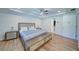 Comfortable main bedroom with tray ceilings, neutral color scheme, and hardwood floors at 3690 Summerpoint Xing, Cumming, GA 30028