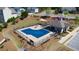 Community pool with lounge area and sunshade, perfect for relaxation and recreation at 3690 Summerpoint Xing, Cumming, GA 30028