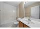 Bathroom with tub and shower combo, vanity, and white fixtures at 4512 Terret Nw Trce, Acworth, GA 30101