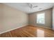 Cozy bedroom featuring hardwood floors, neutral walls, and a ceiling fan at 4512 Terret Nw Trce, Acworth, GA 30101