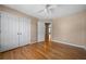 Bedroom featuring hardwood floors, neutral walls, ceiling fan and double closets at 4512 Terret Nw Trce, Acworth, GA 30101
