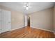 Bedroom featuring hardwood floors, neutral walls, ceiling fan and large closet at 4512 Terret Nw Trce, Acworth, GA 30101