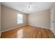 Bright bedroom with hardwood floors, neutral walls, and natural light from the window at 4512 Terret Nw Trce, Acworth, GA 30101