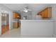 Bright kitchen with oak cabinets, white appliances, and a tiled floor at 4512 Terret Nw Trce, Acworth, GA 30101