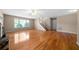 Spacious living room with hardwood floors, large window, staircase, and fireplace at 4512 Terret Nw Trce, Acworth, GA 30101