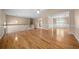 Open-concept living area with hardwood floors, connecting to the dining room and kitchen at 4512 Terret Nw Trce, Acworth, GA 30101