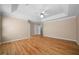 Open main bedroom with hardwood flooring, trey ceilings, and neutral paint at 4512 Terret Nw Trce, Acworth, GA 30101