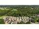 Aerial view showcasing community homes nestled near a lush green golf course at 458 Burgundy Se Ter, Atlanta, GA 30354