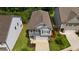 Charming two-story home featuring a neutral palette, attached garage, and a well-manicured front yard at 458 Burgundy Se Ter, Atlanta, GA 30354