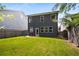 Large, well-maintained backyard with a wooden fence and a patio set on the back porch at 458 Burgundy Se Ter, Atlanta, GA 30354