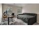 Bedroom with gray walls, daybed, a desk, and two windows for natural light at 458 Burgundy Se Ter, Atlanta, GA 30354