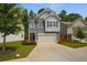 Charming two-story home with a well-manicured lawn and a two-car garage at 458 Burgundy Se Ter, Atlanta, GA 30354