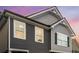 Home's facade is clad with lap siding and contrasting decorative shingles at 458 Burgundy Se Ter, Atlanta, GA 30354
