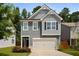 Charming two-story home featuring gray siding, a two-car garage, and a well-manicured front lawn at 458 Burgundy Se Ter, Atlanta, GA 30354