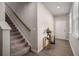 Bright foyer with hardwood floors, staircase, and neutral paint at 458 Burgundy Se Ter, Atlanta, GA 30354