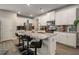 Bright kitchen boasts granite counters, stainless appliances, island with bar seating, and white cabinets at 458 Burgundy Se Ter, Atlanta, GA 30354