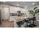 Bright kitchen boasts granite counters, stainless appliances, island with bar seating, and white cabinets at 458 Burgundy Se Ter, Atlanta, GA 30354