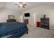 Spacious main bedroom featuring neutral colors, carpet, ceiling fan and several windows for natural light at 458 Burgundy Se Ter, Atlanta, GA 30354