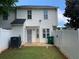 Fenced backyard with a small patio and convenient access, blending indoor/outdoor living at 5897 Strathmoor Manor Cir, Lithonia, GA 30058