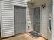 View of the back entrance and small patio in the backyard with a white fence surrounding at 5897 Strathmoor Manor Cir, Lithonia, GA 30058