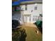 Cozy backyard featuring a white privacy fence and small patio area for outdoor relaxation at 5897 Strathmoor Manor Cir, Lithonia, GA 30058
