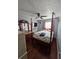 Charming bedroom with hardwood floors, a four-poster bed, and a decorative ceiling fan at 5897 Strathmoor Manor Cir, Lithonia, GA 30058