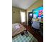 Functional bedroom setup with a desk, a bed, and a TV for work and relaxation at 5897 Strathmoor Manor Cir, Lithonia, GA 30058
