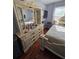 Bedroom with a dresser, a bed and a wooden floor at 5897 Strathmoor Manor Cir, Lithonia, GA 30058