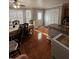 Cozy dining area features a table with chairs and large windows for natural light at 5897 Strathmoor Manor Cir, Lithonia, GA 30058