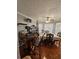 Dining room showcases an elegant table set under a modern ceiling fan, with natural light at 5897 Strathmoor Manor Cir, Lithonia, GA 30058