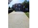 Charming townhome featuring a private entrance and long driveway at 5897 Strathmoor Manor Cir, Lithonia, GA 30058