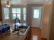 Bright kitchen boasting granite countertops, a stainless steel sink, and natural light streaming in from the windows at 5897 Strathmoor Manor Cir, Lithonia, GA 30058