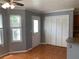 Eat-in kitchen filled with natural light, complete with backdoor access and additional storage space at 5897 Strathmoor Manor Cir, Lithonia, GA 30058