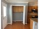 Well-lit kitchen featuring a laundry closet and easy access to outside via backdoor entrance at 5897 Strathmoor Manor Cir, Lithonia, GA 30058