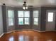 Bright living area with three windows offering lots of natural light, perfect for relaxing or entertaining at 5897 Strathmoor Manor Cir, Lithonia, GA 30058