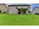 Grassy backyard showing the exterior elevation at 3419 Mulberry Cove Way, Auburn, GA 30011