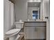 Bathroom with granite countertop, framed mirror, toilet, and a shower with a curtain at 3419 Mulberry Cove Way, Auburn, GA 30011