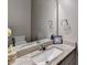 Elegant half bathroom featuring granite countertop and modern fixtures at 3419 Mulberry Cove Way, Auburn, GA 30011