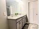 Stylish bathroom with double granite sinks, modern fixtures, and ample storage space at 3419 Mulberry Cove Way, Auburn, GA 30011