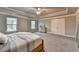 Large bedroom features plush carpet, neutral walls, tray ceiling, and lots of closet space at 3419 Mulberry Cove Way, Auburn, GA 30011