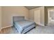 Neutral bedroom featuring a bed, carpet flooring, and a closet for ample storage space at 3419 Mulberry Cove Way, Auburn, GA 30011