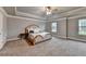 Spacious bedroom features plush carpet, neutral walls, tray ceiling with fan, and large windows at 3419 Mulberry Cove Way, Auburn, GA 30011