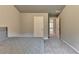 Neutral bedroom with carpet flooring, and a door leading to other areas of the house at 3419 Mulberry Cove Way, Auburn, GA 30011